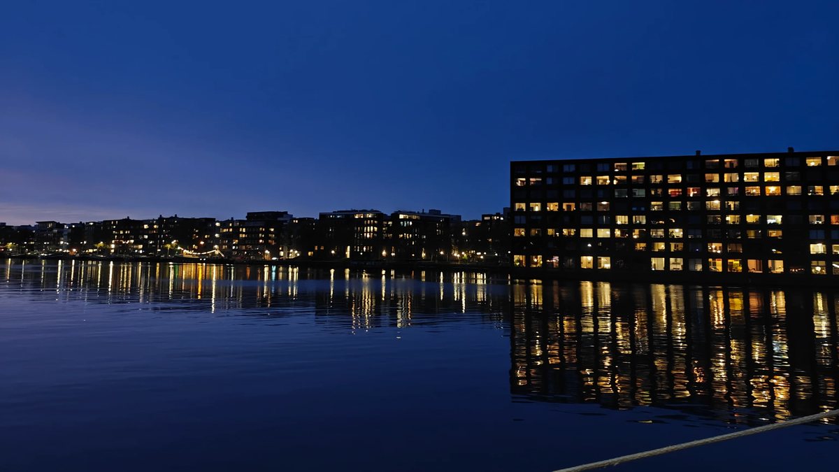 Queued video preview: the Amsterdam harbor at dusk.