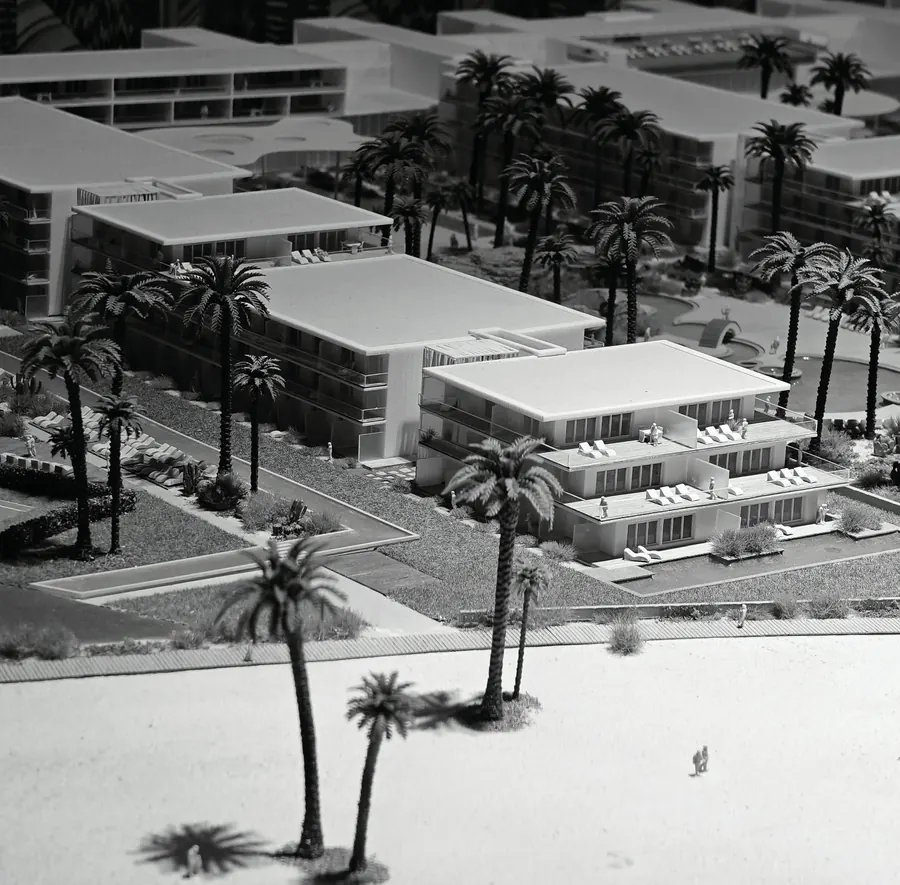A scale architectural model of a palm-lined resort bay, photographed at an exhibition at the RAI Amsterdam