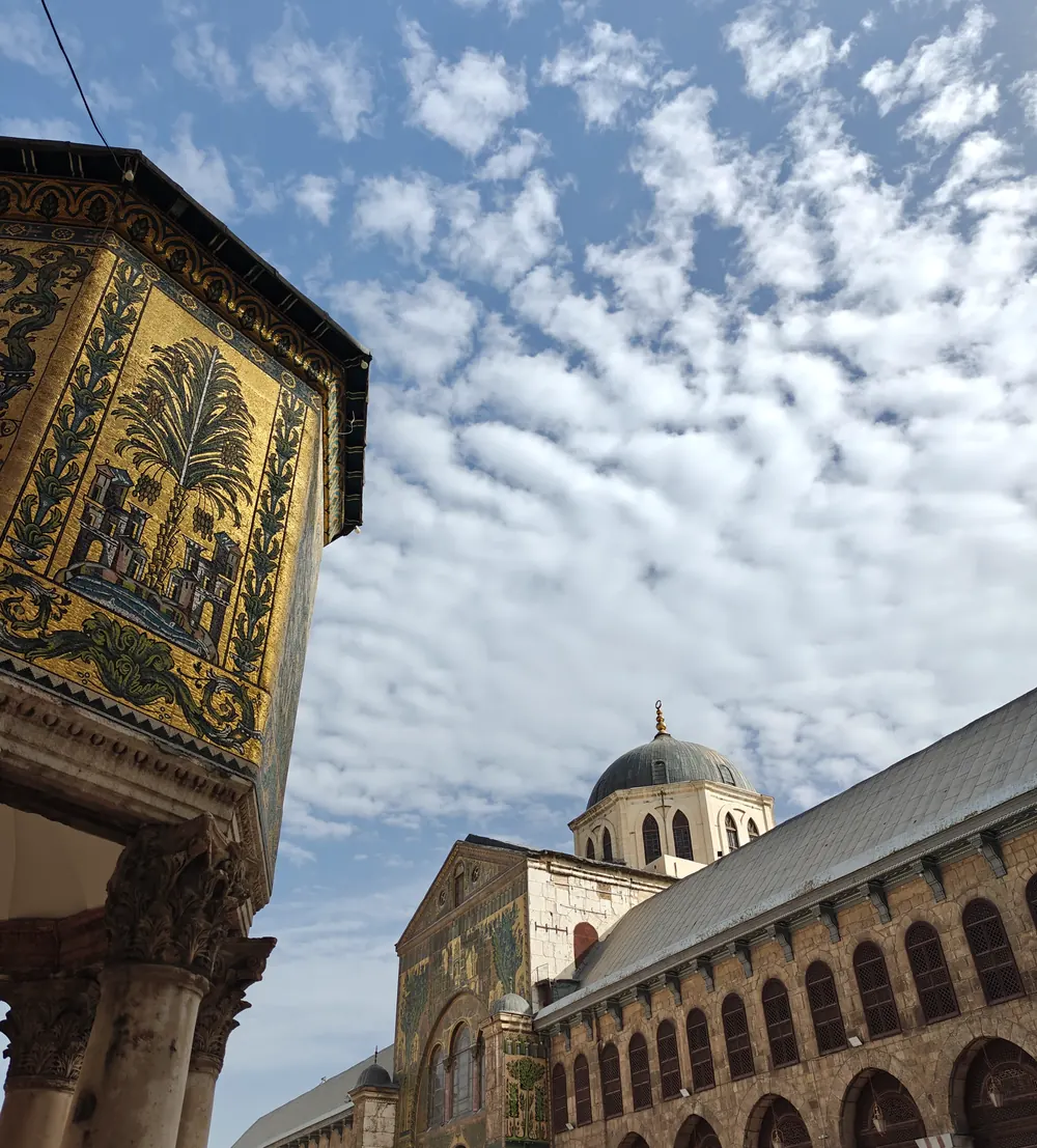 The mosaic-clad treasury dome at the Omayyad Mosque in Damascus against a mackerel sky